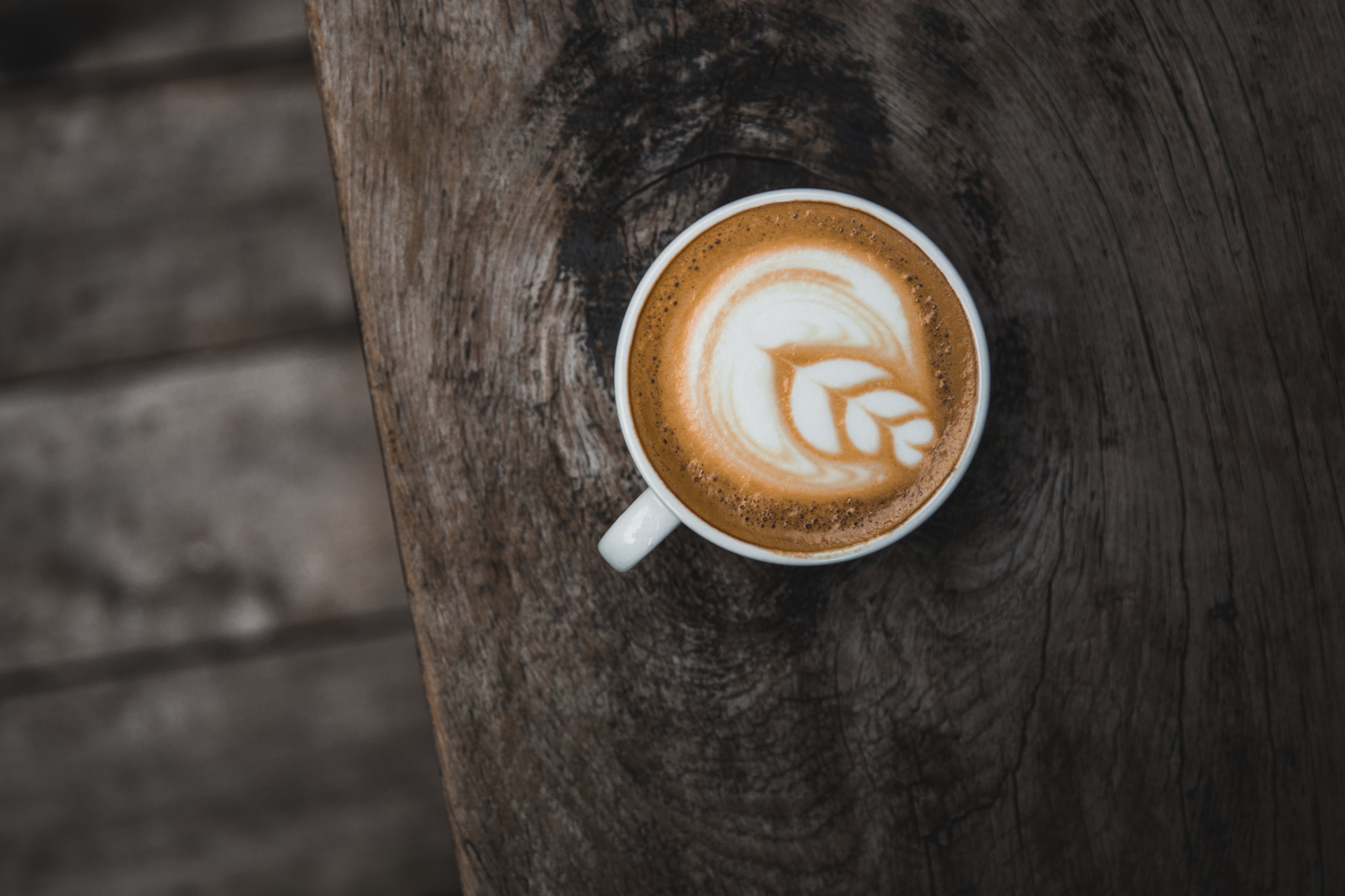 Cup of Faborava Coffee on Wooden Table